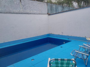 Casa com Piscina para Temporada com 3 quartos - Jardim Real - Praia Grande